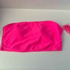 Neon pink swimwear tube top.